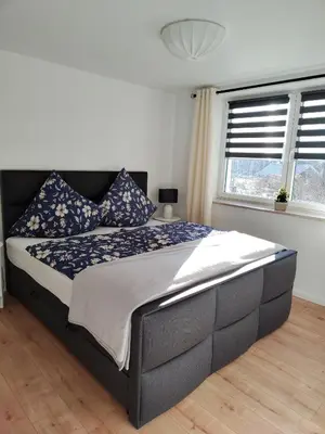 Ein Bett oder Betten in einem Zimmer der Unterkunft Ferienwohnung zur alten Post