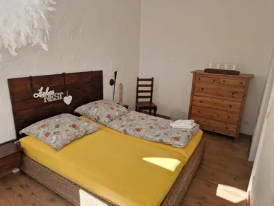 Ein Bett oder Betten in einem Zimmer der Unterkunft Ferienwohnung Carola Scholze