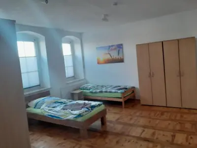 Ein Bett oder Betten in einem Zimmer der Unterkunft Monteurswohnung Place2stay in Großenhain