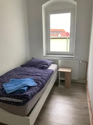 Ein Bett oder Betten in einem Zimmer der Unterkunft Monteurswohnung Place2stay in Großenhain