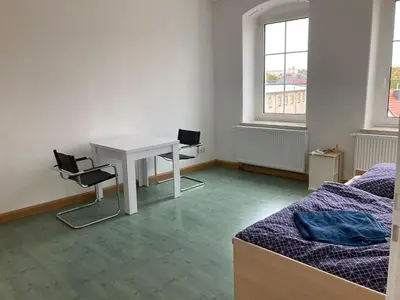 Ein Bett oder Betten in einem Zimmer der Unterkunft Monteurswohnung Place2stay in Großenhain