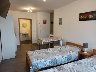 Ein Bett oder Betten in einem Zimmer der Unterkunft Gästewohnung Fischer