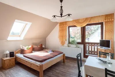 Ein Bett oder Betten in einem Zimmer der Unterkunft Ferienwohnung Hetzdorf - Urlaub am Tharandter Wald