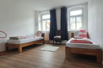Ein Bett oder Betten in einem Zimmer der Unterkunft Monteurswohnung Roßwein - Zentral - Küche