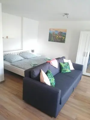 Ein Bett oder Betten in einem Zimmer der Unterkunft Ferienwohnung Haufe