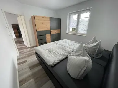 Ein Bett oder Betten in einem Zimmer der Unterkunft Ferienhaus Helfert FeWo 1 mit großer Terrasse