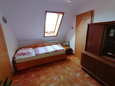 Ein Bett oder Betten in einem Zimmer der Unterkunft Ferien im Haus am Waldrand