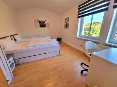 Ein Bett oder Betten in einem Zimmer der Unterkunft FEWO 