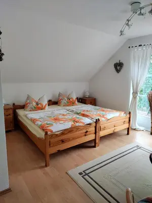 Ein Bett oder Betten in einem Zimmer der Unterkunft Gästezimmer am Malerweg