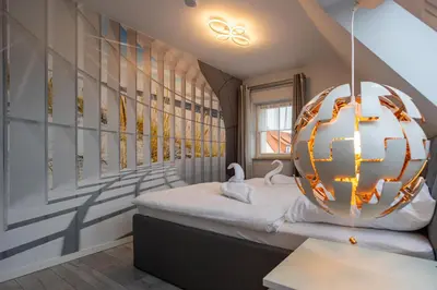 Ein Bett oder Betten in einem Zimmer der Unterkunft Ferienwohnung Gartenstadt Seilerberg