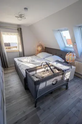 Ein Bett oder Betten in einem Zimmer der Unterkunft Ferienwohnung Gartenstadt Seilerberg