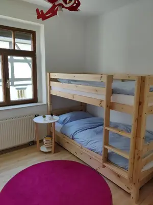 Ein Bett oder Betten in einem Zimmer der Unterkunft Ferienwohnung Obere Aue
