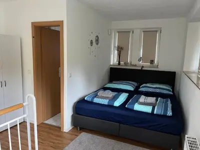 Ein Bett oder Betten in einem Zimmer der Unterkunft Turmwohnung