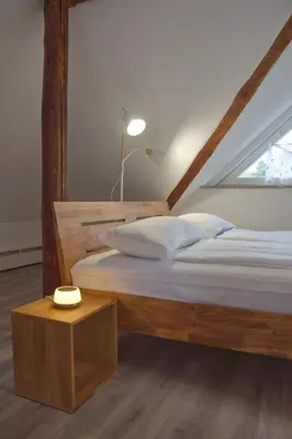 Ein Bett oder Betten in einem Zimmer der Unterkunft Apartment Traumzeit mit Balkon in Vorstadtvilla