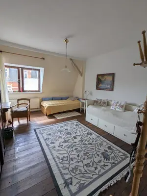 Ein Bett oder Betten in einem Zimmer der Unterkunft Apartment-Mansardwohnung