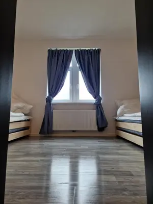 Ein Bett oder Betten in einem Zimmer der Unterkunft Ausblick Freital