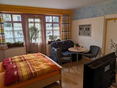 Ein Bett oder Betten in einem Zimmer der Unterkunft Gästehaus Locanda al Castello Stolpen