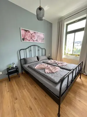Ein Bett oder Betten in einem Zimmer der Unterkunft K2-Project - Zeitreise ins Smart Living