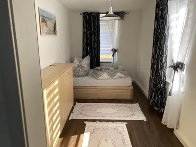 Ein Bett oder Betten in einem Zimmer der Unterkunft Ferienwohnung Pension Sofia 2