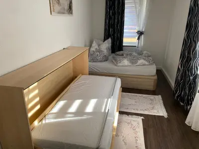 Ein Bett oder Betten in einem Zimmer der Unterkunft Ferienwohnung Pension Sofia 2