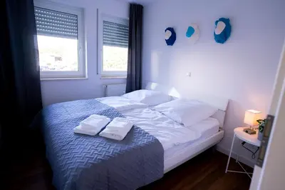 Ein Bett oder Betten in einem Zimmer der Unterkunft Design Apartment - Balkon - Induktionskochfeld - Zentral