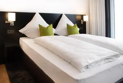 Ein Bett oder Betten in einem Zimmer der Unterkunft OSL Hotel by WMM Hotels