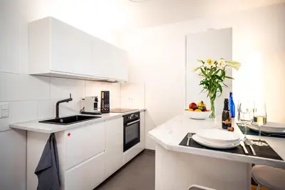 Küche/Küchenzeile in der Unterkunft NK Apartments - Hafencity Dresden mit Elbblick - Modern & Zentral