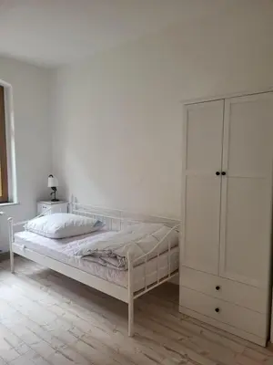 Ein Bett oder Betten in einem Zimmer der Unterkunft Ferienwohnungen Königstein