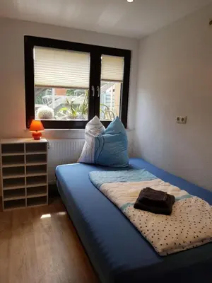 Ein Bett oder Betten in einem Zimmer der Unterkunft Ferienwohnung an der Kurpromrnade