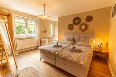 Ein Bett oder Betten in einem Zimmer der Unterkunft Innenstadt Appartement *Garten*