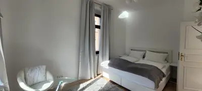 Ein Bett oder Betten in einem Zimmer der Unterkunft Stilvolle Ferienwohnung Dresden