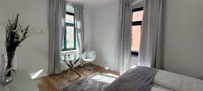 Ein Bett oder Betten in einem Zimmer der Unterkunft Stilvolle Ferienwohnung Dresden