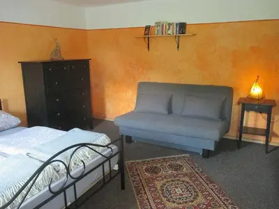 Ein Bett oder Betten in einem Zimmer der Unterkunft Ferienwohnung im grünen Elbtal