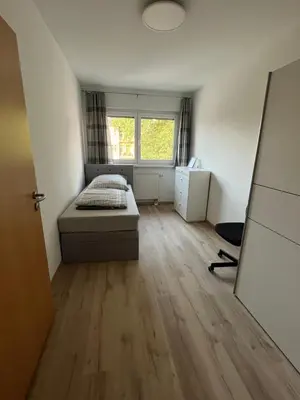 Ein Bett oder Betten in einem Zimmer der Unterkunft NP-Apartments Blasewitz