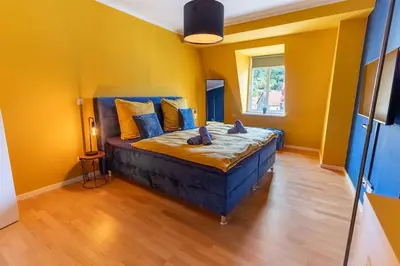 Ein Bett oder Betten in einem Zimmer der Unterkunft Penthouse Apartment Pirna 6 Personen, WLAN, Waschmaschine