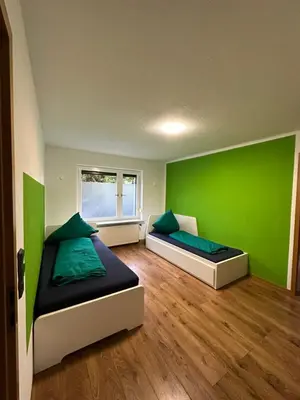 Ein Bett oder Betten in einem Zimmer der Unterkunft Pension „Haus 11“ Lauta