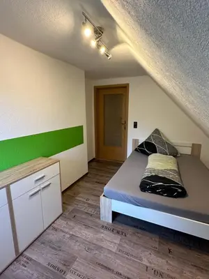 Ein Bett oder Betten in einem Zimmer der Unterkunft Pension „Haus 11“ Lauta