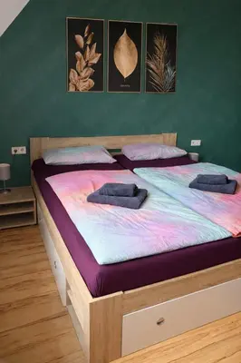 Ein Bett oder Betten in einem Zimmer der Unterkunft Schöne Wohnung in einer ruhiger Umgebung