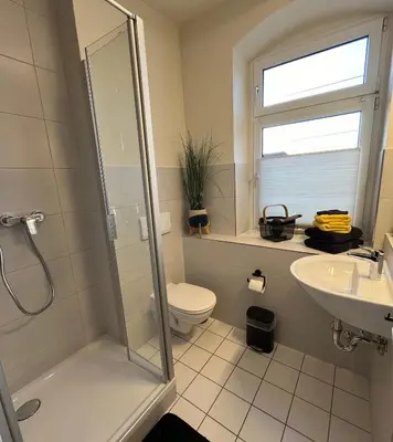 Ein Badezimmer in der Unterkunft Pension Kulturhaus Niederau
