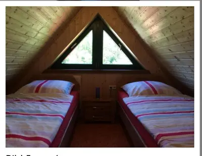 Ein Bett oder Betten in einem Zimmer der Unterkunft Weidmannsruh - große Ferienwohnung mit 3 Schlafzimmern