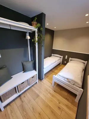 Ein Bett oder Betten in einem Zimmer der Unterkunft Ferienhaus-DP8
