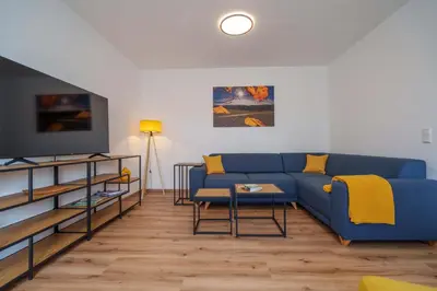 Ein Sitzbereich in der Unterkunft HERZstück Erzgebirge