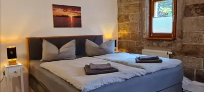 Ein Bett oder Betten in einem Zimmer der Unterkunft Ferienwohnung am Bächelweg