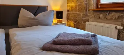 Ein Bett oder Betten in einem Zimmer der Unterkunft Ferienwohnung am Bächelweg