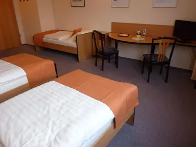 Ein Bett oder Betten in einem Zimmer der Unterkunft Pension an der Weisseritz