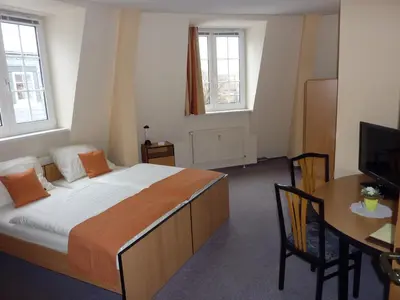 Ein Bett oder Betten in einem Zimmer der Unterkunft Pension an der Weisseritz