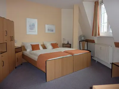 Ein Bett oder Betten in einem Zimmer der Unterkunft Pension an der Weisseritz