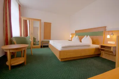 Ein Bett oder Betten in einem Zimmer der Unterkunft Pension Am Finkenberg
