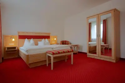 Ein Bett oder Betten in einem Zimmer der Unterkunft Pension Am Finkenberg