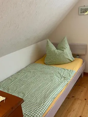Ein Bett oder Betten in einem Zimmer der Unterkunft Großzügiges Ferienhaus nahe Rochlitz